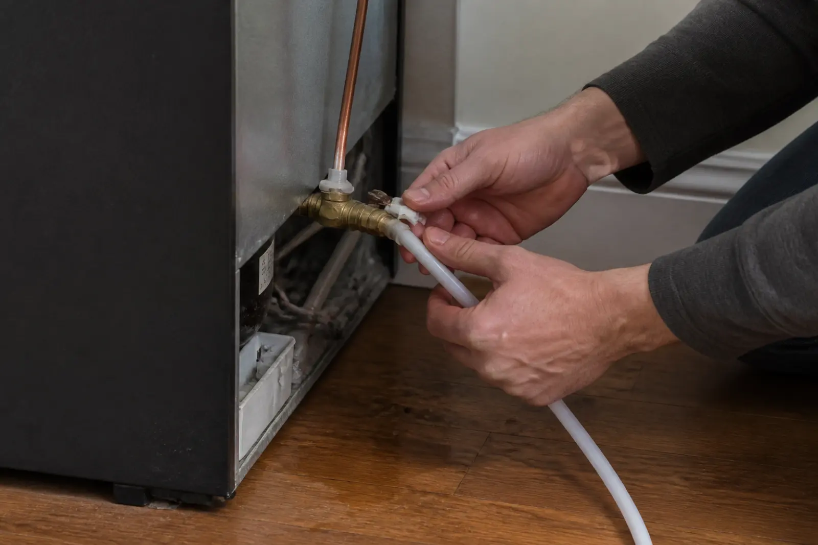 Water valve access behind a Northlake townhome refrigerator
